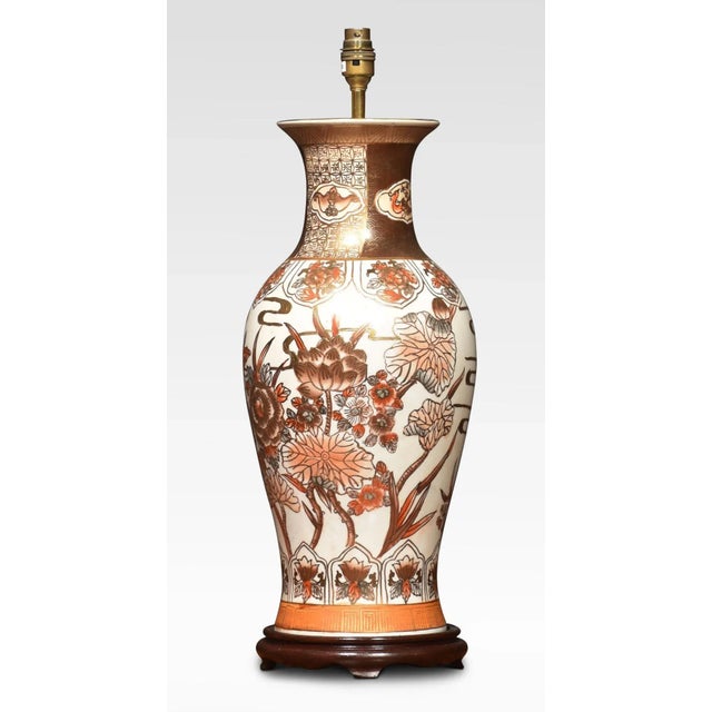 Japanese Satsuma porcelain vases lamp of baluster form raised up on stepped wooden base. The lampshade is not included....