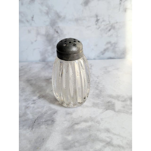 A lovely vintage crystal silver lidded replacement salt shaker. The intricate ribbed detailing makes this a classic design.