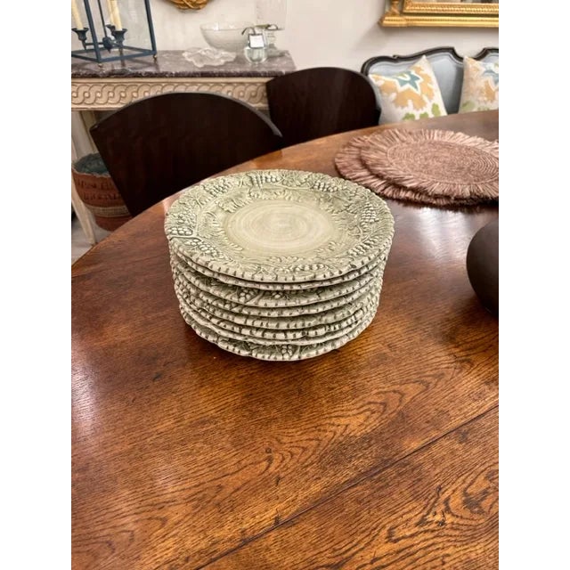 This is a large dinner plate by Williams Sonoma in the Sage Napa pattern. Made of ceramic with grapevines throughout and a...
