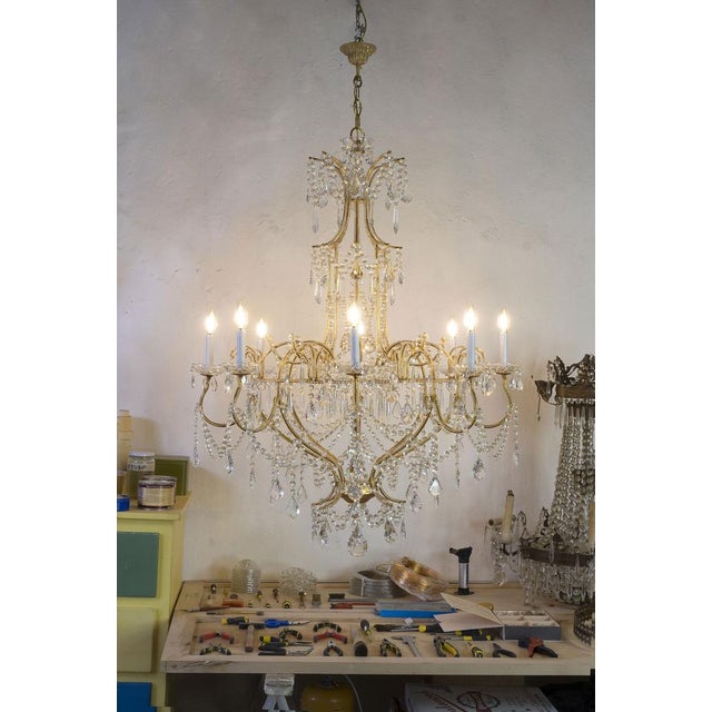 Large empire style chandelier in golden metal, illuminated by 8 lights e12 (us wiring). Chandelier with a very large...