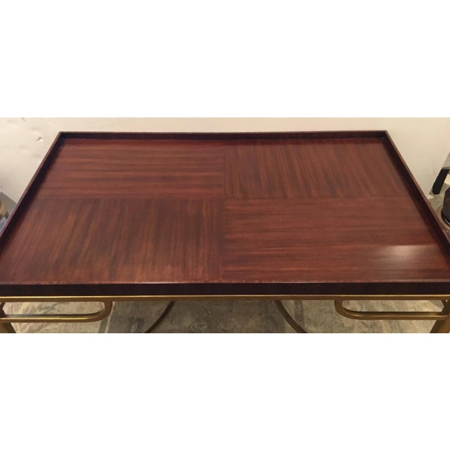 Stylish Henredon Modern Wood and Gold Cocktail Table, warm mahogany finished top, metal base, showroom floor sample,...