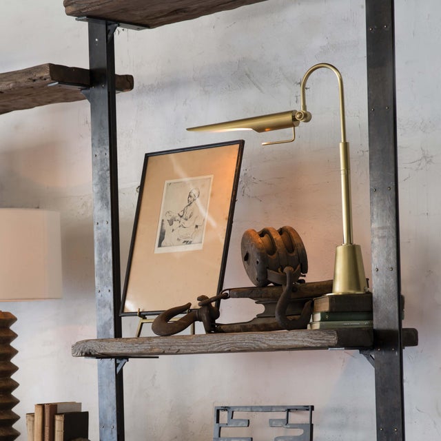 Its aerodynamic design with an adjustable shade, evoking a bird-like silhouette, makes this lamp a functional piece of...