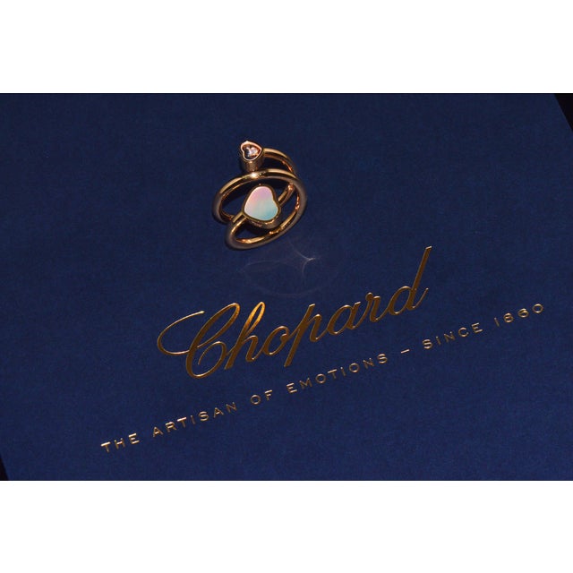 Authentic Chopard Happy Hearts Twist solid 18K ethical rose gold natural floating diamond and mother-of-pearl ring. This...