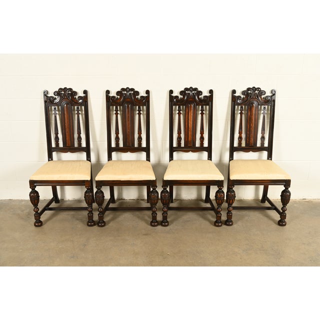 A beautiful set of four antique English Jacobean or Tudor style side chairs or dining chairs By Berkey & Gay USA, Circa...