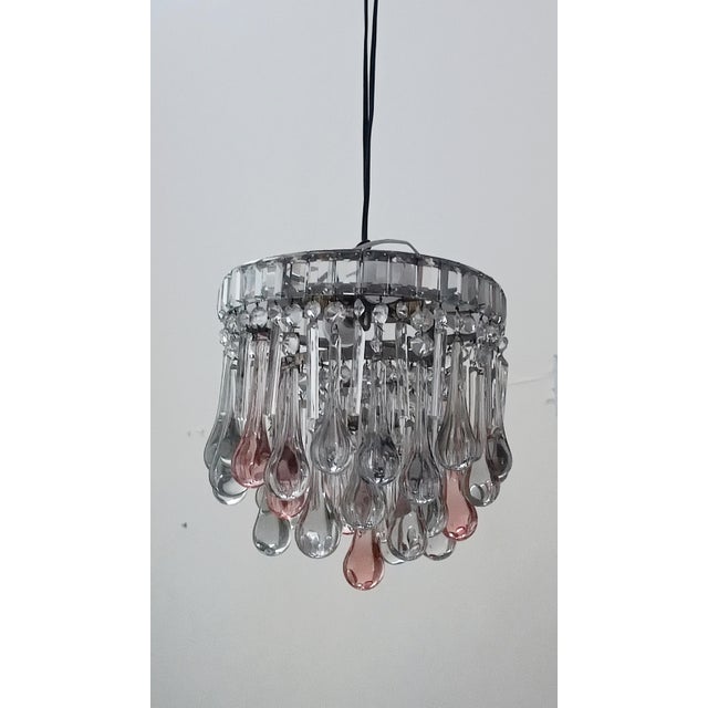 Beautiful hanging teardrop chandelier. Italy, 1960s. Matte silver-plated metal frame. It supports magnificent Murano glass...