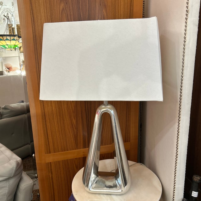 This is a spaces age Hollywood Regency style desk or table lamp. It’s made of ceramic with a chrome crackle finish and...