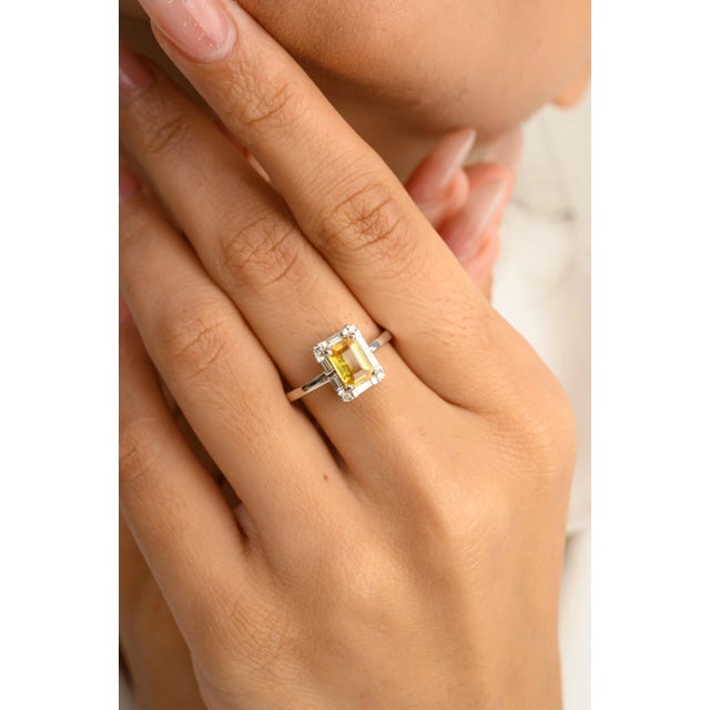 This is part of Chairish’s Fine Jewelry assortment. Octagon Cut Yellow Sapphire and Diamond Halo Birthstone Ring in 14K...
