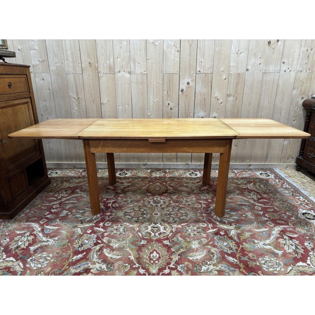 Elegant rectangular table in solid elm, dating from the second half of the 20th century (circa 1950–1970). The tabletop...