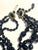 West German mid-century statement necklace features a three-strand graduated construction crafted from faceted black jet...