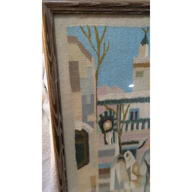 A charming vintage hand-woven textile art piece depicting a lively South American street scene, likely set in an Andean...