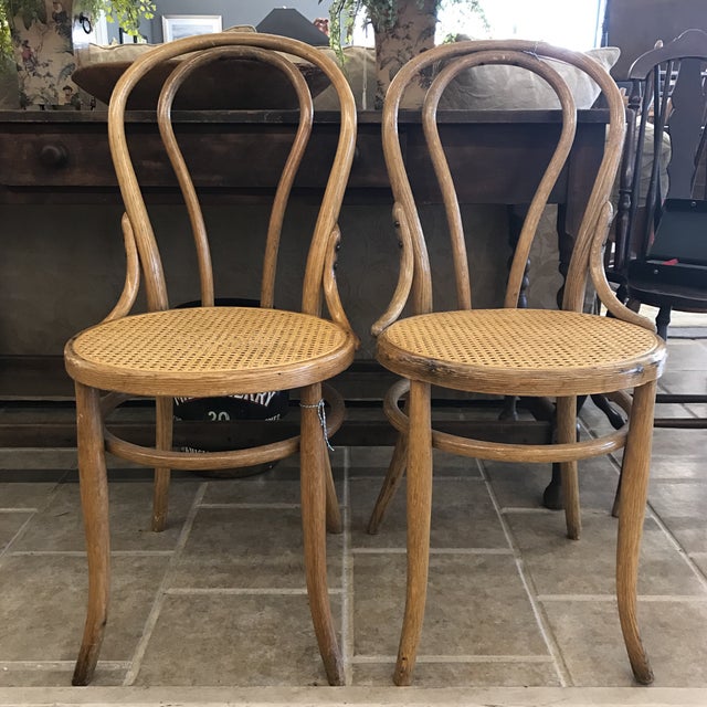 Cane Seat Bistro Chairs In The Style of Michael A Pair Chairish