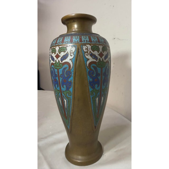This antique Japanese enameled bronze champleve vase is a stunning piece of Asian art from the late 19th century. Made in...