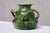 This Art Nouveau vase was produced in Belgium circa 1910. It bears an impressed BELGIUM mark on the lower body, a...