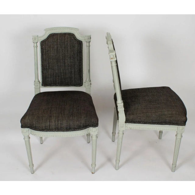 An absolutely fantastic set of 10 vintage Louis XVI Revival blue-grey painted dining chairs. These chairs have been...