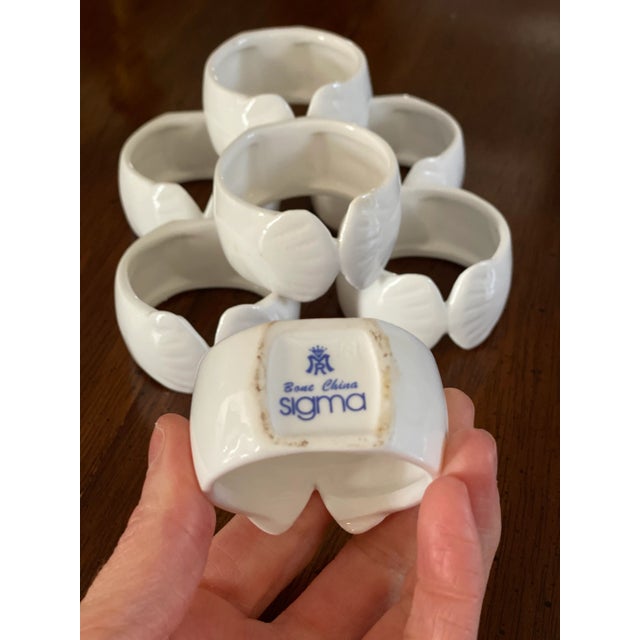 Set of seven- vintage Sigma Bone China- white shell napkin rings. These would be such fun addition to your table.