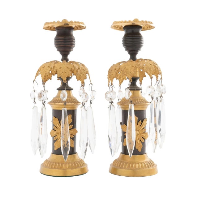 Pair of cast bronze patinated candlesticks with applied stamped & gilt lacquered brass embellishments. The foliate luster...