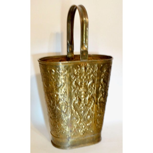 Antique English solid brass handled umbrella and stick stand. It has a lovely soft gilt brass patina, embossed design and...