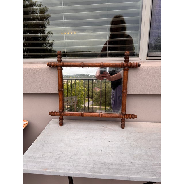 French faux bamboo wood mirror, circa 1900. Height / 18.5 inches, Width / 22 inches. Mirror / 14.7 by 11.5 inches.