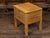 A rustic English pine box on legs from the early 20th century, with brass escutcheon. Created in England during the early...