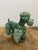 This large 25 cm poodle is finished in the iconic, deep-green lead glaze that made the ateliers of Vallauris famous. While...
