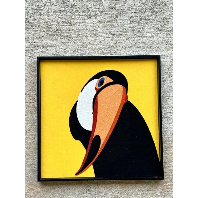 Infuse your space with vibrant color and artistic charm through this vintage framed toucan textile art, a beautifully...