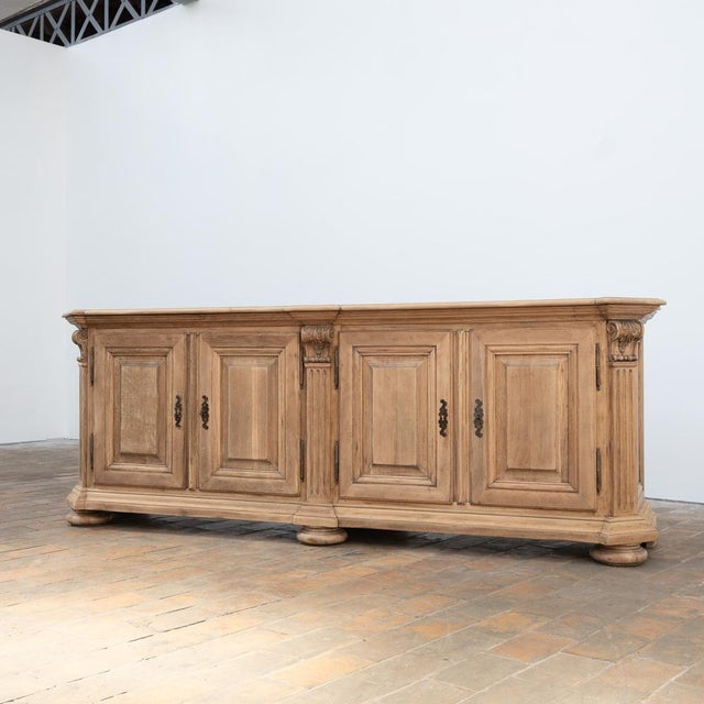 Large solid oak sideboard with four lockable doors on the front. Beautifully designed structure with fluted uprights,...