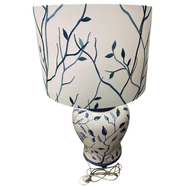This Italian-made ceramic table lamp captures the timeless charm of Mediterranean artisan craft with a classic Chinoiserie...