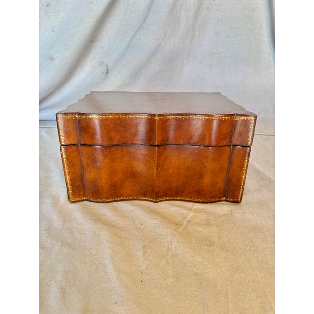 This 20th Century Italian Embossed Leather Box dates back to the mid 1900's. The piece features a scalloped design covered...