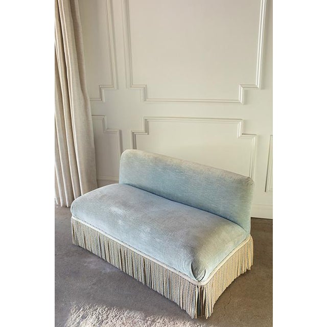 Elevate your space with this striking bench-made, low-profile armless settee, crafted by the historic luxury manufacturer...