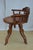 Very stylish and comfortable Aesthetic Movement revolving desk chair in walnut, having shaped and carved top rail with a...