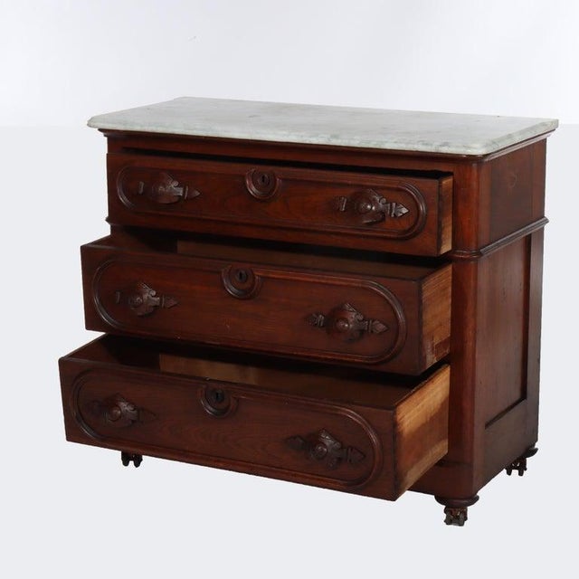 Antique Walnut 3-Drawer Marble Top Commode With Carved Pulls C1890 Measures - 33 3/8" x 39 5/8" x 17 1/2" An antique...