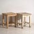 A pair of antique bedside tables in pine wood, with a square top and four tapered legs tied by box stretchers. They...