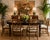 Elegant vintage Asian-inspired dining table featuring a rich black lacquered wood frame with contrasting warm wood-grain...