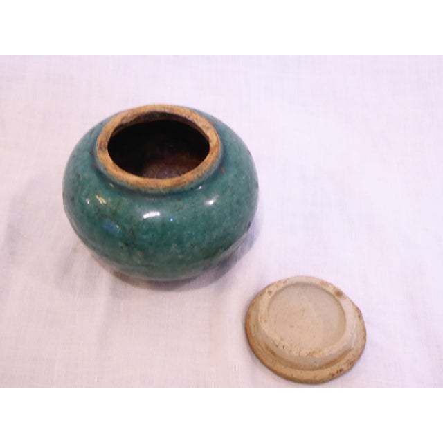 This covered ceramic jar is marked "China" on the underside, a type of marking used in the early 20th Century.