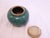 This covered ceramic jar is marked "China" on the underside, a type of marking used in the early 20th Century.