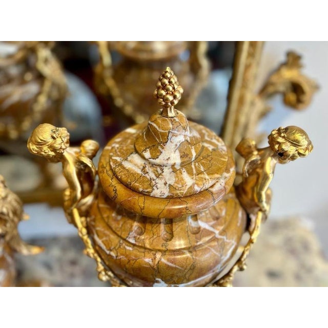 A splendid pair of large Louis XVI style cassolettes in light brown marble with white veining from the Napoleon III...