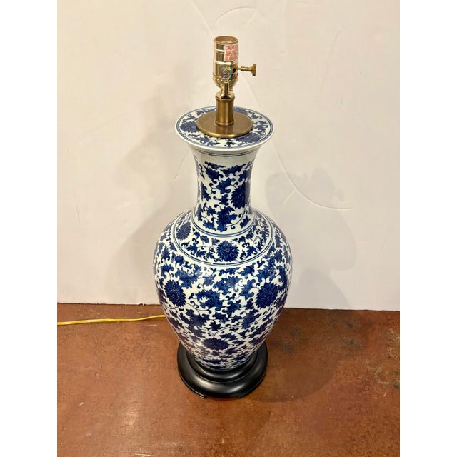 Stylish Currey & Co Porcelain jar lamp, blue and white glaze, floral desing. Showroom floor sample.