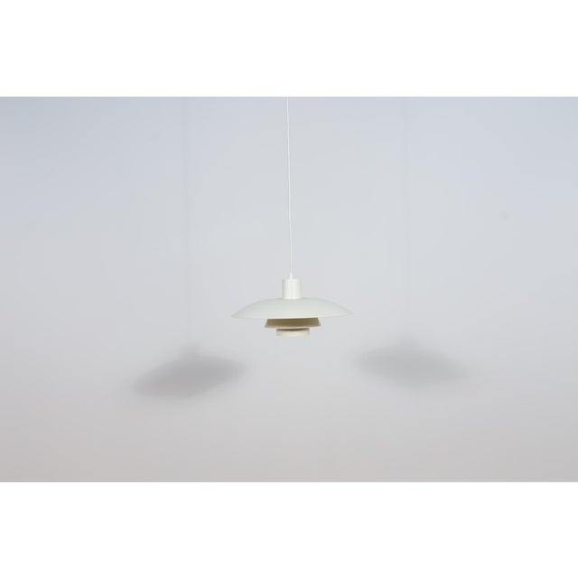 This pendant was designed by Poul Henningsen and produced by Louis Poulsen from 1966 until it was discontinued in this...