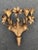 Large Italian Gilt Iron Floral Wall Sconce. Adorned with five elaborate Tiger Lilly flowers and four candle holders. It...