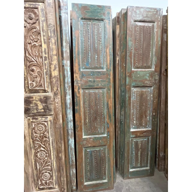 Bring timeless character and artisan craftsmanship into your home with these hand-carved reclaimed wood double doors....