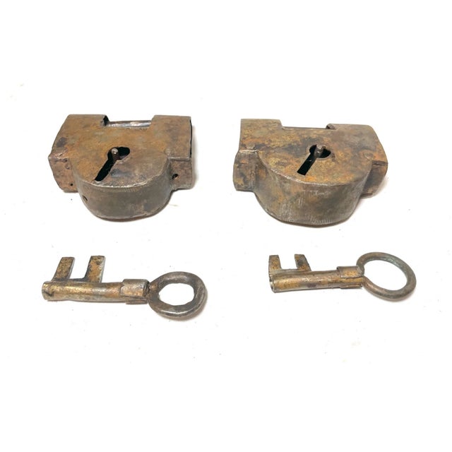 Up for sale is a very rare pair of antique early 19th century handmade pad locks. They're made of solid wrought iron and...
