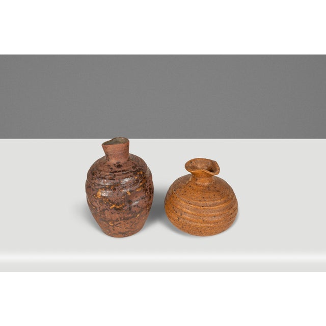 Introducing a splendid pair of Japanese-made Yaki Ikebana flower vases crafted from porcelain bases with a characteristic...