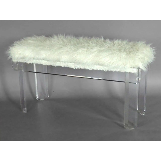 White faux covered Lucite bench in the style of Charles Hollis Jones or Ritts .