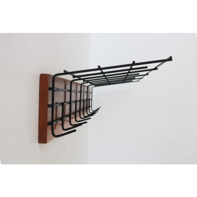 Striking Dutch Design coat rack from the 1950s , superb minimalism by Tjerk Reijenga for Pilastro. The black metal...