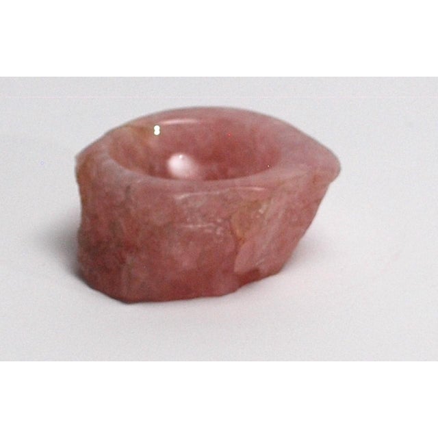 A bowls made of thoroughly processed natural minerals of various kinds. Rose quartz and agate.