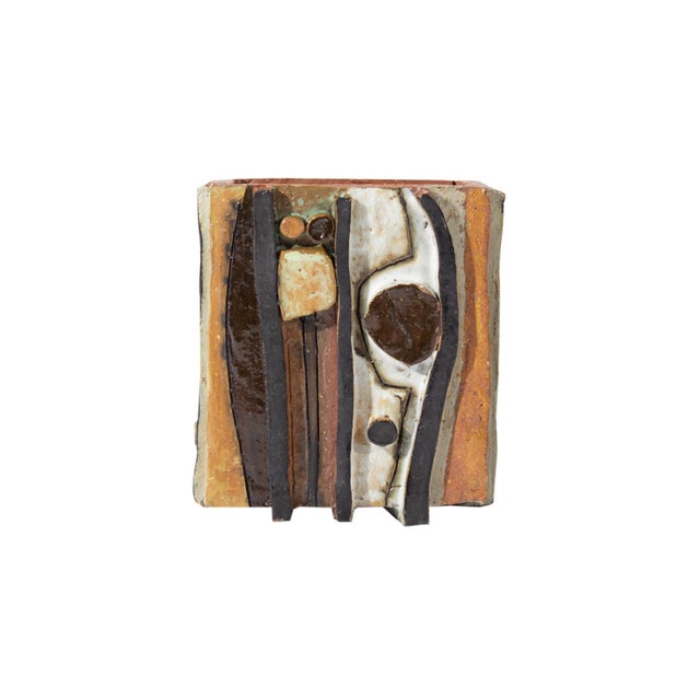 A 1967 studio pottery vase by American artist Mary Ann Wurst. This hand-built vase features applied stripes and circular...