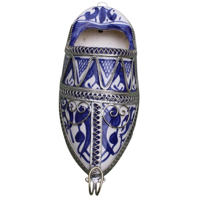 Handcrafted Moroccan ceramic babouche with hand-painted Moorish pattern and intricate silver inlay. This beautiful accent...