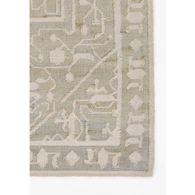 Adorned with antique Anatolian designs, as well as classic Heriz patterns, this subtle blue rug feels like a sophisticated...