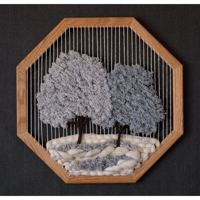 The sweetest looking macrame wallhanging you'll ever lay eyes on! This rare 1970s textile art piece depicts a calming...