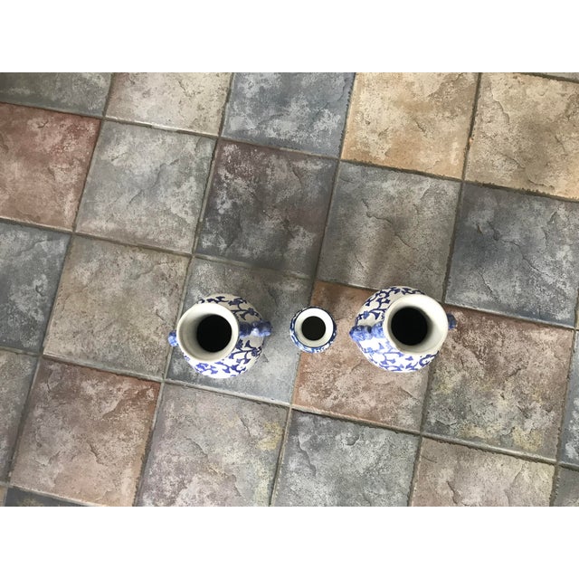 2000 - 2009 Large 14" Vintage Chinoiserie Blue & White Lotus Vases With Foo Dog Handles – Pair For Sale - Image 5 of 8